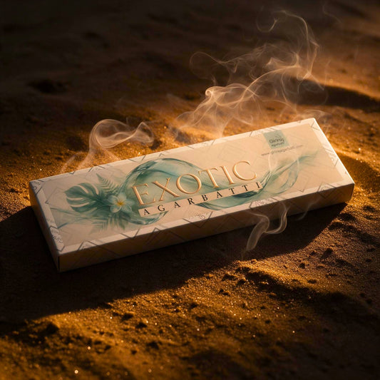 Exotic agarbatti box on golden sand with rising smoke