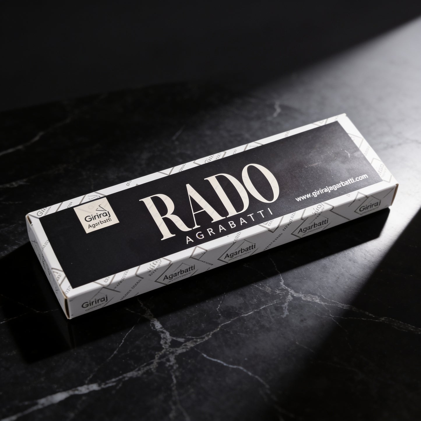 Rado Agarbatti incense box on black marble