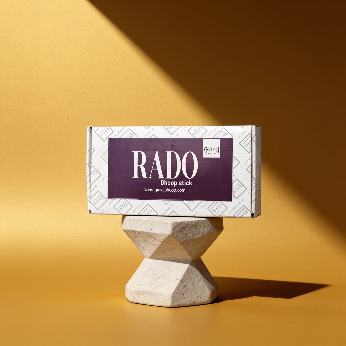 Rado Dhoop Stick premium bamboo-free incense box by Giriraj on a sculptural pedestal