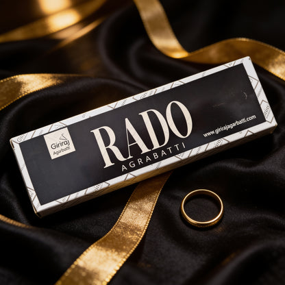 Rado Agarbatti incense box on black silk with a gold ring